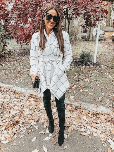 woman wearing plaid jacket and black boots