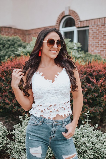 woman in white crochet tank top