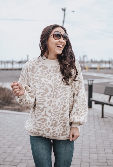 woman wearing leopard sweater