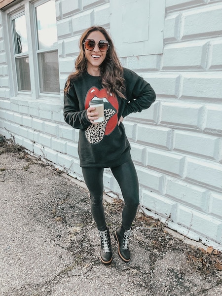 woman wearing faux leather leggings and sweatshirt