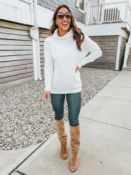woman in sweater and knee high boots
